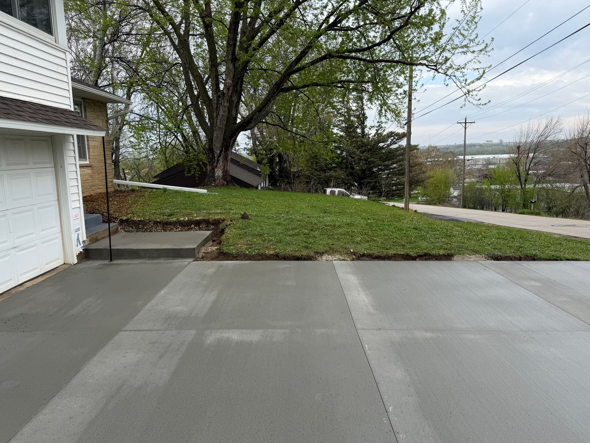 Gallery photos for Front Yard Regrading and Topsoil Cleanup After New Concrete: Image #1